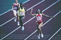 Seoul, S. Korea: Florence Joyner crosses the finish line to win Gold Medal in the 200 meter. - © John Francis Ficara.<br> All Rights Reserved.