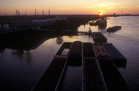 New Orleans, Louisiana: Barge traffic on the Mississippi River. - © John Francis Ficara.<br> All Rights Reserved.