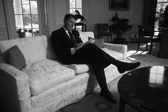 Washington DC:
Pres. Ronald Reagan works on his State of the Union speech in the Oval office.
