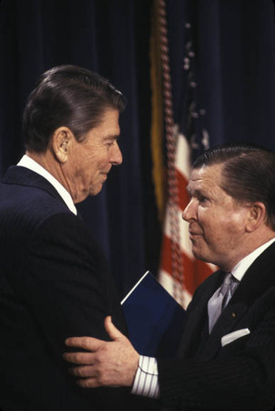 Washington DC:
Sen. John Tower presents the Tower Report to Pres. Reagan critical of the administration's Iran Contra Policy.