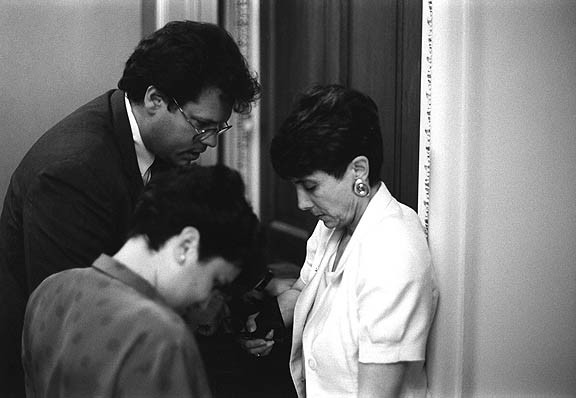          THE CRUCIAL BUDGET VOTE: 
Congresswoman Mezvinsky in the Speakers
 Lobby off the House floor in a final moment
 with her chief of staff and another staffer
 before deciding to cast her vote in support
 of Bill Clinton's budget.