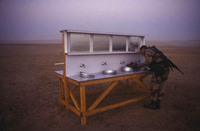 Saudi Arabia: Member of the 1st cavalry prepares for morning watch. - © John Francis Ficara.<br> All Rights Reserved.