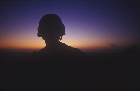 Saudi Arabia:

Desert dawn watch for 1st calvary soldier.